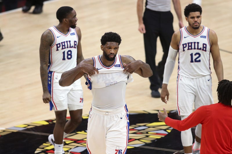 Philadelphia 76ers center Joel Embiid (21), guard Shake Milton (18) and forward Tobias Harris (12) 