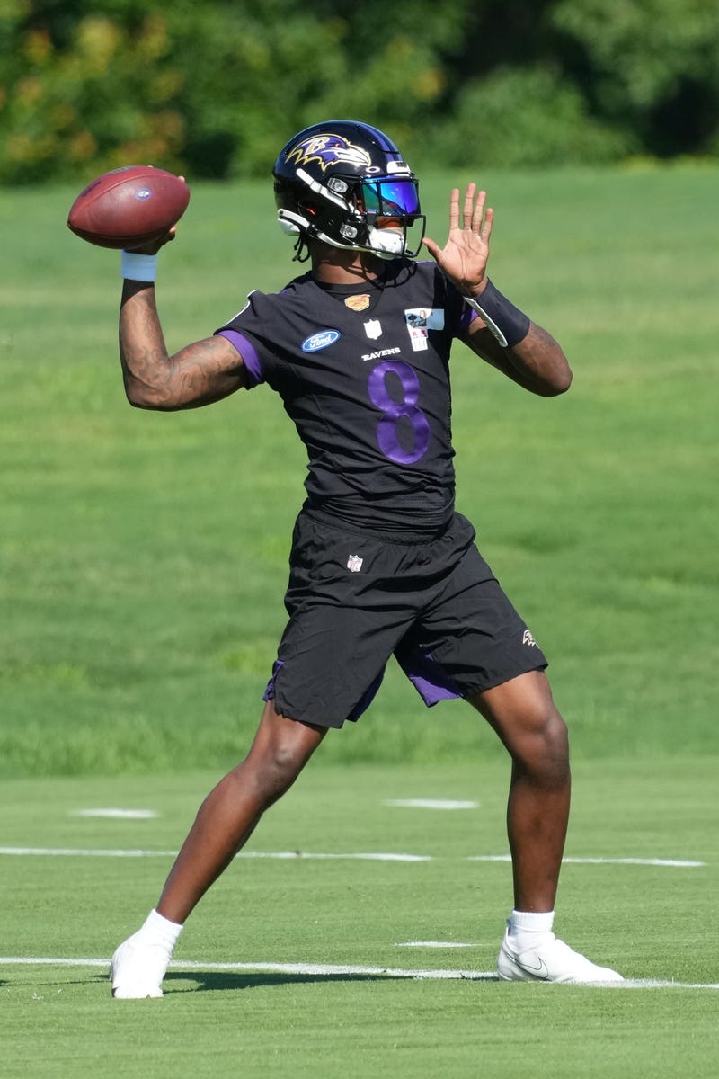 Jun 15, 2021; Owings Mills, Maryland, USA; Baltimore Ravens quarterback Lamar Jackson (8) throws a pass during mandatory mini camp at the Under Armor Performance Center. Mandatory Credit: Mitch Stringer-USA TODAY Sports