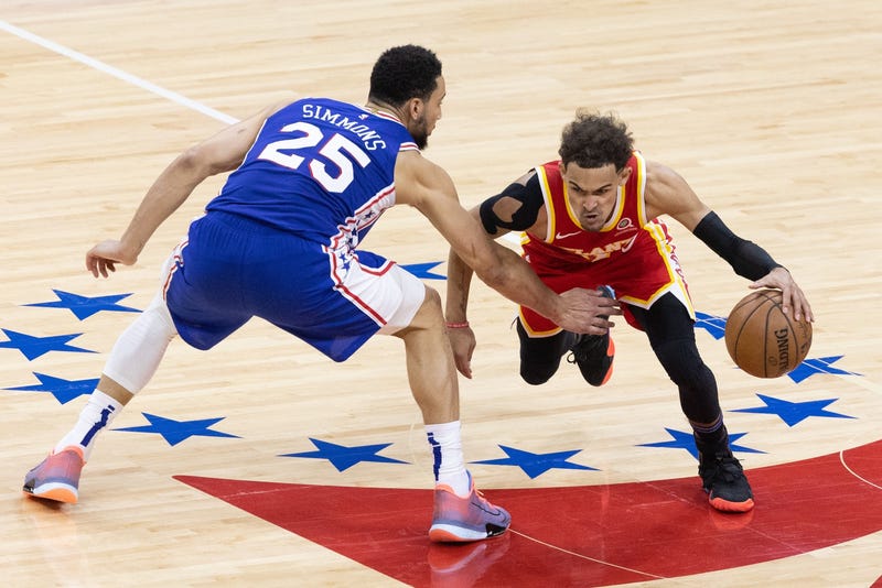 Atlanta Hawks guard Trae Young dribbles past Philadelphia 76ers guard Ben Simmons