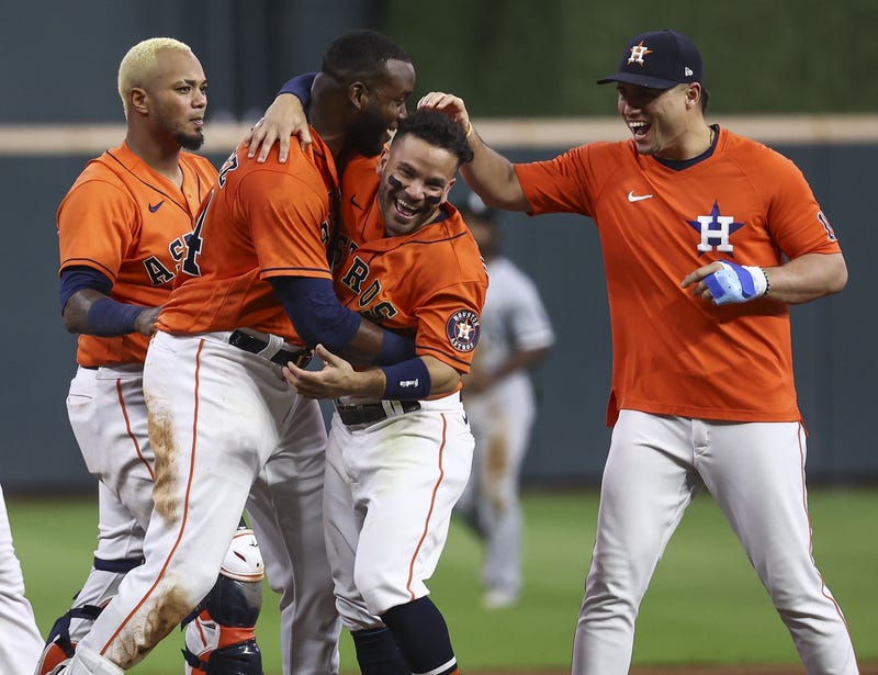 Houston Astros designated hitter Yordan Alvarez (44) celebrates with teammates after driving in a run during the ninth inning against the Chicago White Sox at Minute Maid Park.