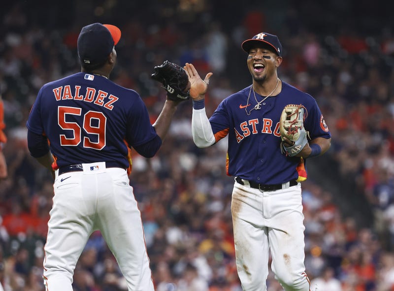 Houston Astros third baseman Robel Garcia (9) is congratulated by starting pitcher Framber Valdez (59) after a defensive play by Garcia in the fifth inning against the Chicago White Sox at Minute Maid Park.