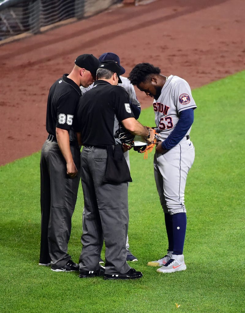 Houston Astros pitcher Christian Javier (53) is checked by umpires after pitching in the seventh inning against the Baltimore Orioles at Oriole Park at Camden Yards.