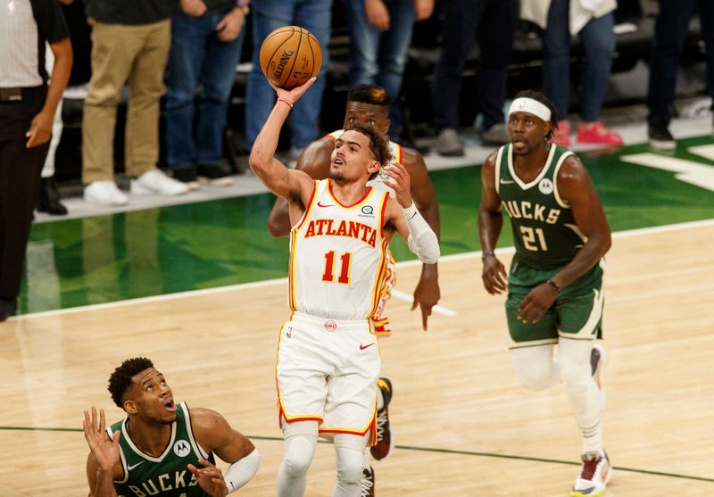 Hawks star Trae Young attempts a shot.