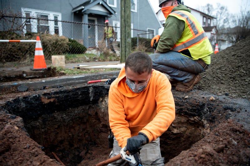 Fernando Silva and Jason Conklin replace lead service water lines with copper piping on Sanford Avenue in Newark on March 24, 2021, as part of Newark's Lead Service Replacement Program.