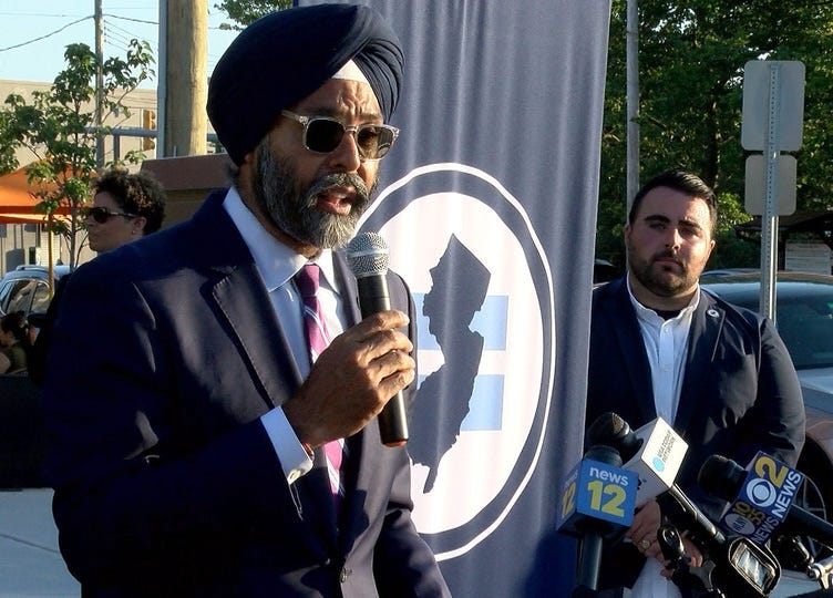 New Jersey Attorney General Gurbir S. Grewal formally apologizes for his office's role in the systematic targeting of gay bars between 1933 and 1967 during an event memorializing the former site of an Asbury Park bar subject to those discriminatory actions at Main Street and Cookman Avenue Tuesday evening, June 29, 2021. At right is Christian Fuscarino, executive director, Garden State Equality.