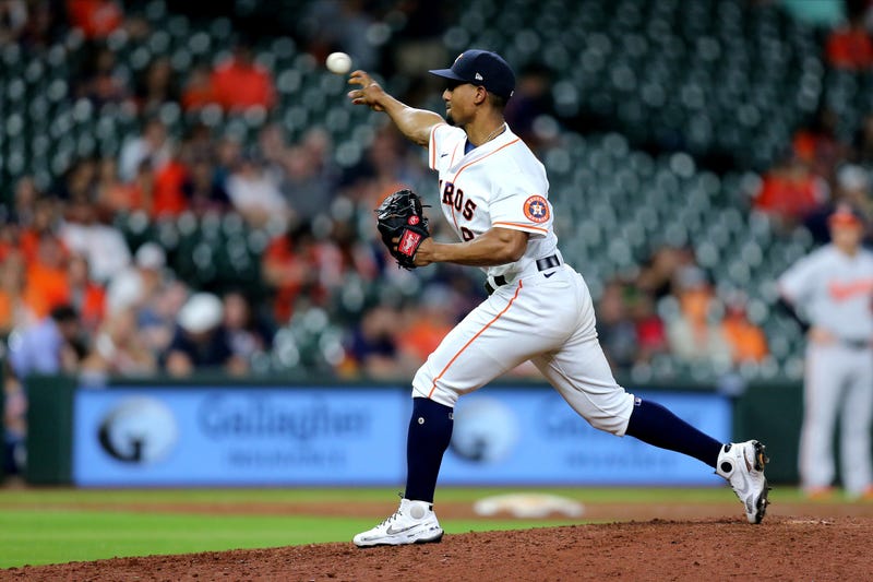 Houston Astros infielder Robel Garcia (9) delivers a pitch against the Baltimore Orioles during the ninth inning at Minute Maid Park.