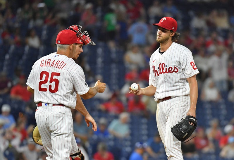Philadelphia Phillies starting pitcher Aaron Nola and manager Joe Girardi.