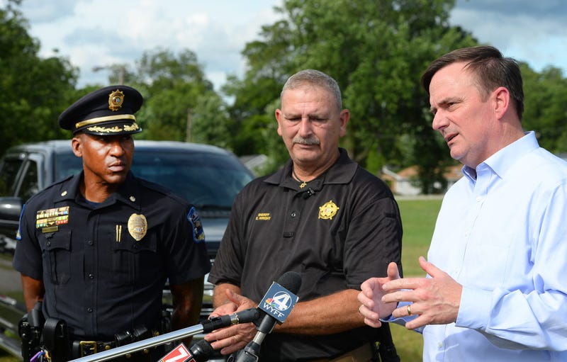 Major Art Littlejohn from the city of Spartanburg Police department, Spartanburg County Sheriff Chuck Wright and Greenville County Sheriff Hobart Lewis at a press conference held at the Piedmont Interstate Fair near Cleveland Park