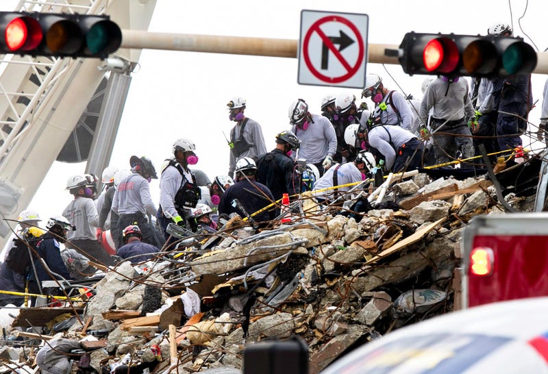 Rescue workers at the Surfside, Fla., condominium collapse site. 