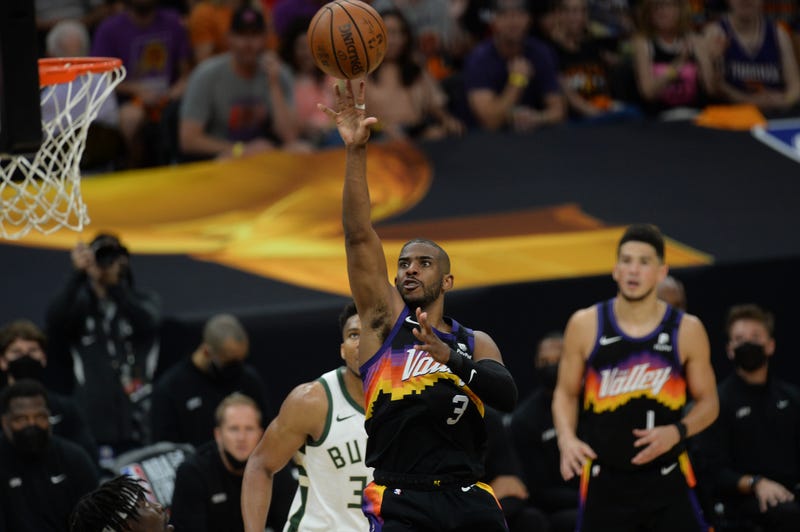 Suns veteran guard Chris Paul drives to the hoop.