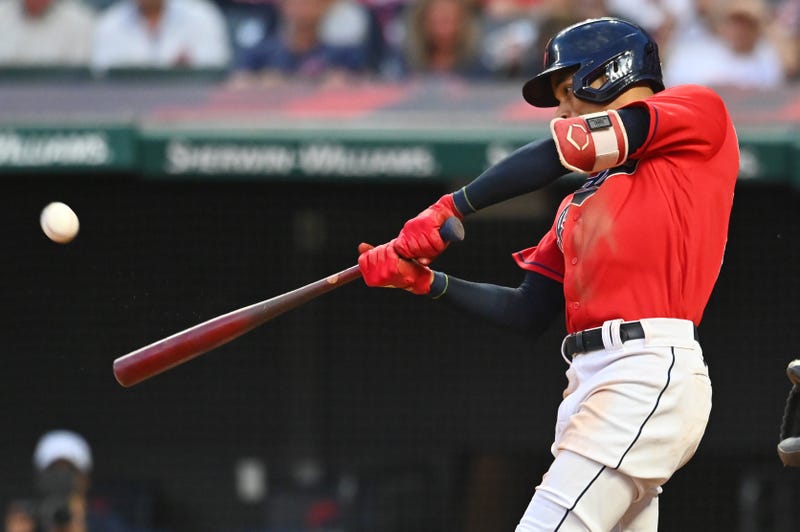 Jul 10, 2021; Cleveland, Ohio, USA; Cleveland Indians left fielder Oscar Mercado (35) hits a home run against the Kansas City Royals during the seventh inning at Progressive Field.