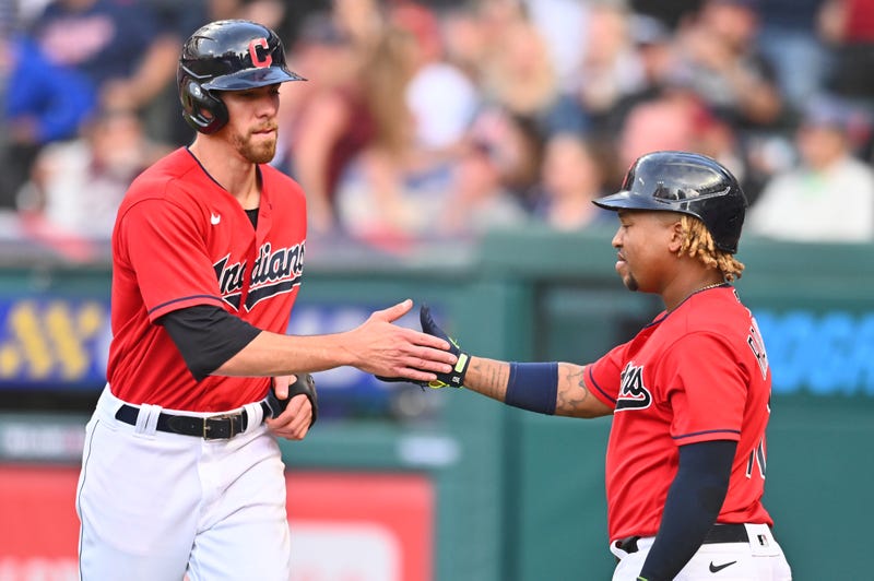 Jul 10, 2021; Cleveland, Ohio, USA; Cleveland Indians center fielder Bradley Zimmer (4) celebrates with third baseman Jose Ramirez (11) after scoring against the Kansas City Royals during the sixth inning at Progressive Field.