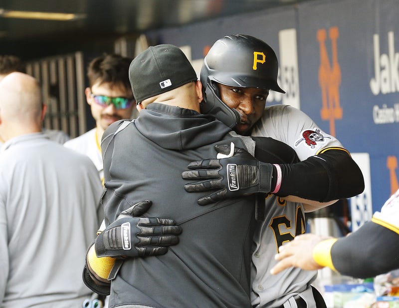 Rodolfo Castro hugging in dugout