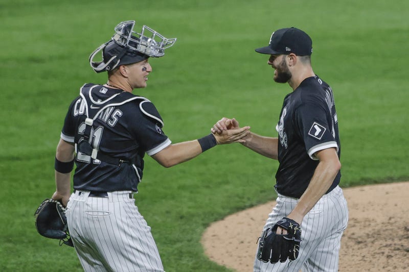 Chicago White Sox starting pitcher Lucas Giolito (right) celebrates with catcher Zack Collins (21) after defeating the Houston Astros at Guaranteed Rate Field.