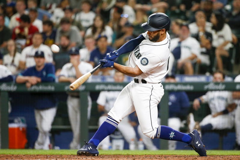 Seattle Mariners pinch hitter Abraham Toro (13) hits a two run home run against the Houston Astros during the ninth inning at T-Mobile Park.