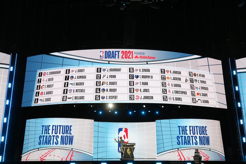 NBA commissioner Adam Silver waves as he walks off the stage after the first round of the 2021 NBA Draft at Barclays Center. 