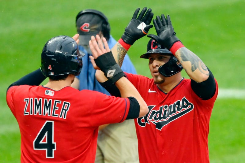 Aug 9, 2021; Cleveland, Ohio, USA; Cleveland Indians catcher Wilson Ramos (40) celebrates with right fielder Bradley Zimmer (4) after hitting a two-run home run against the Cincinnati Reds in the second inning at Progressive Field.