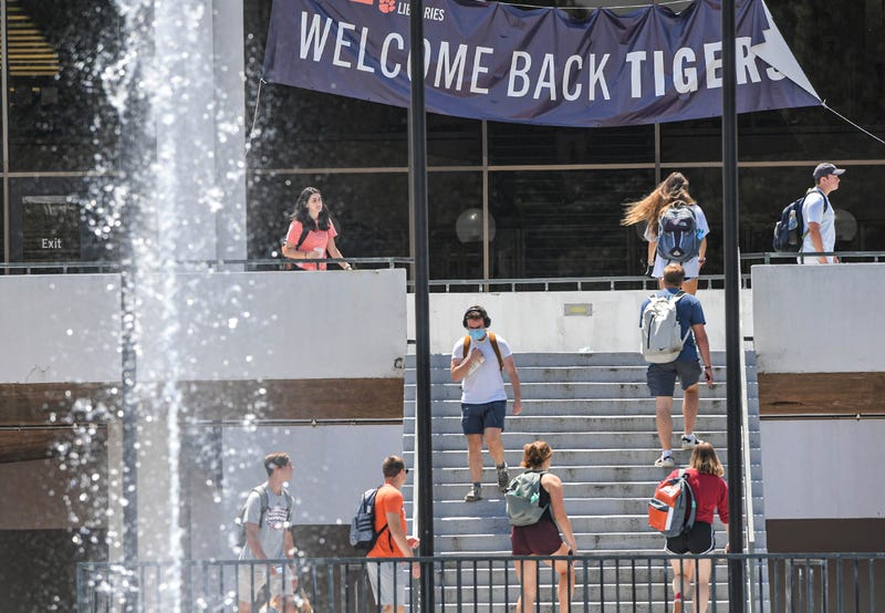 Clemson University students walk by the Cooper Library in Clemson, S.C. Friday, August 20, 2021. - File Photo