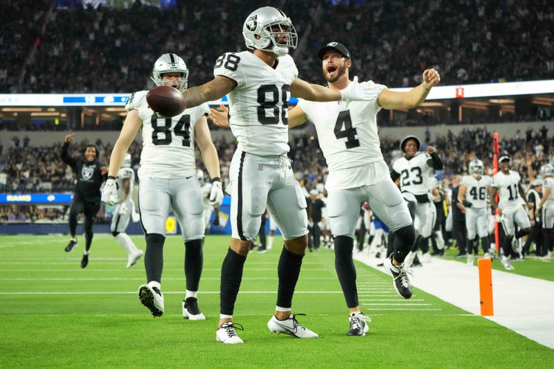 The Raiders celebrate a 4th quarter score against the Rams on August 21st, 2021