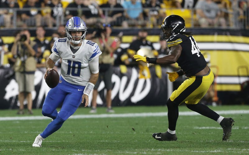 Lions quarterback David Blough (10) scrambles with the ball as Pittsburgh Steelers linebacker Jamir Jones (44) chases