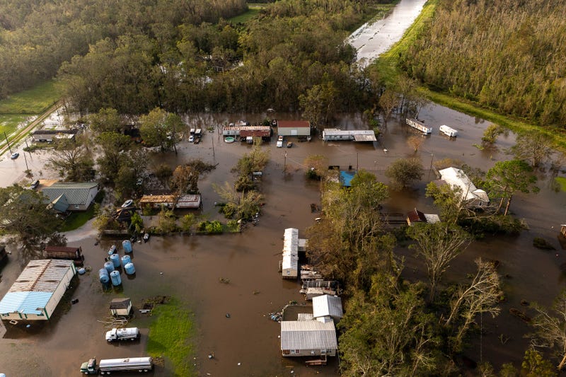 Flooded yards and downed trees are the norm after the passage of Hurricane Ida in the small southern Louisiana town of Schriever on Aug. 30, 2021. Aem Schriever Ida 1