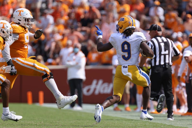 Brandon Hill running w football
