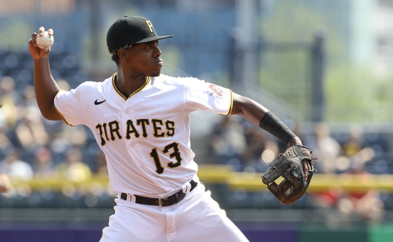 Pittsburgh Pirates third baseman Ke'Bryan Hayes (13) throws to first base to record an out against Washington Nationals