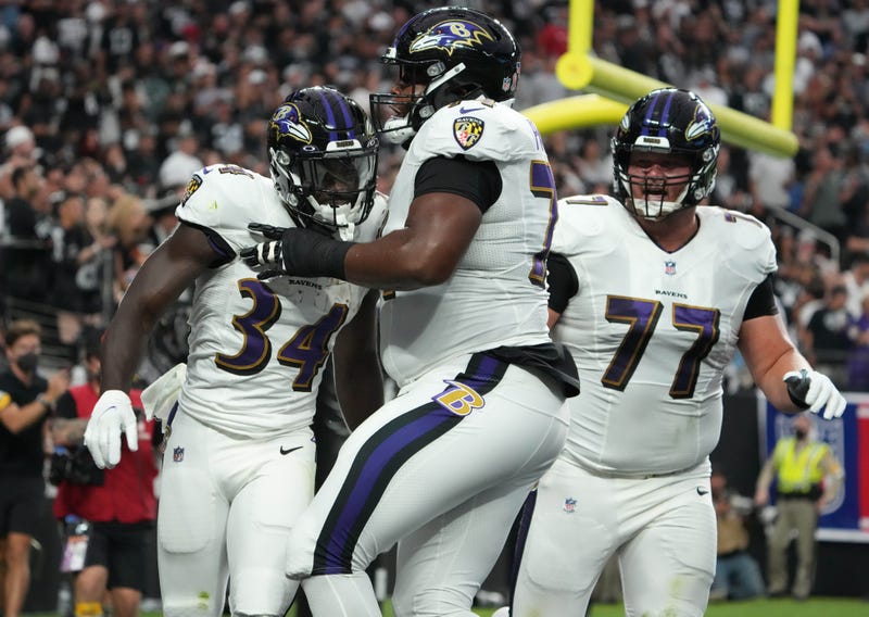 Bradley Bozeman and Tyre Phillips celebrate Ty'son Williams' TD run