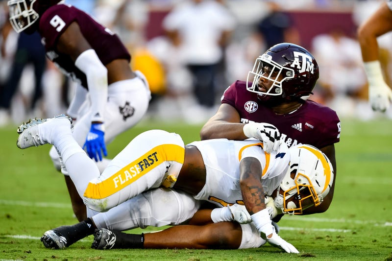 Texas A&M Aggies defensive lineman Jayden Peevy (92) tackles Kent State Golden Flashes running back Marquez Cooper (1) during the first half at Kyle Field.