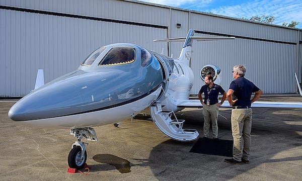 Matt Liotta, co-founder and CEO of Volato, and pilot Gary Brose stand next to one of their HondaJet Elite S corporate jets at the Northeast Florida Regional Airport on Friday, September 17, 2021