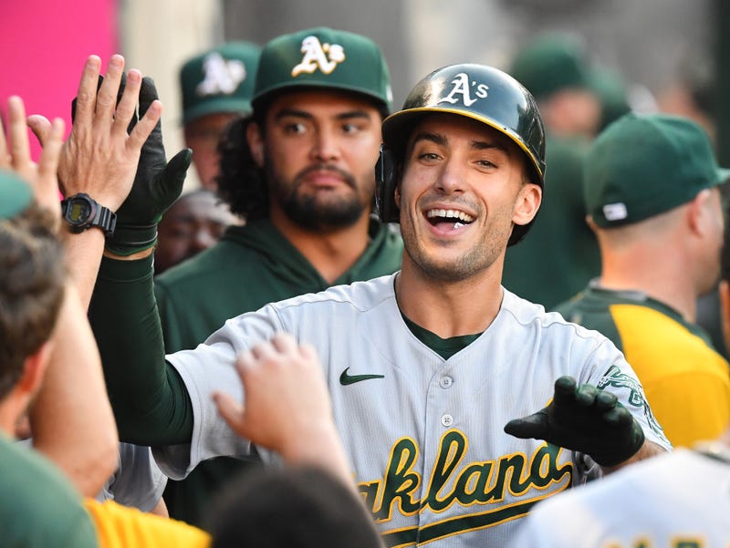 Oakland Athletics first baseman Matt Olson (28) is congratulated in the dugout after hitting a solo home run against the Los Angeles Angels in the first inning at Angel Stadium.