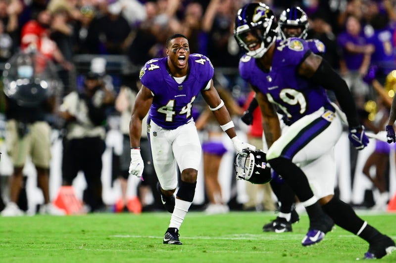 Ravens players celebrate after recovering a fumble with less than 90 seconds left.