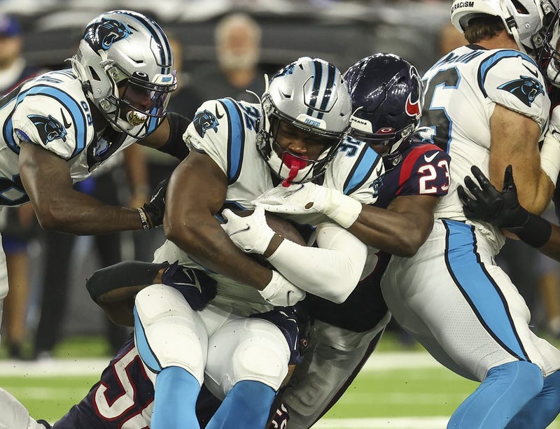 Carolina Panthers running back Royce Freeman (32) carries the ball as Houston Texans free safety Eric Murray (23) attempts to make a tackle during the fourth quarter at NRG Stadium.