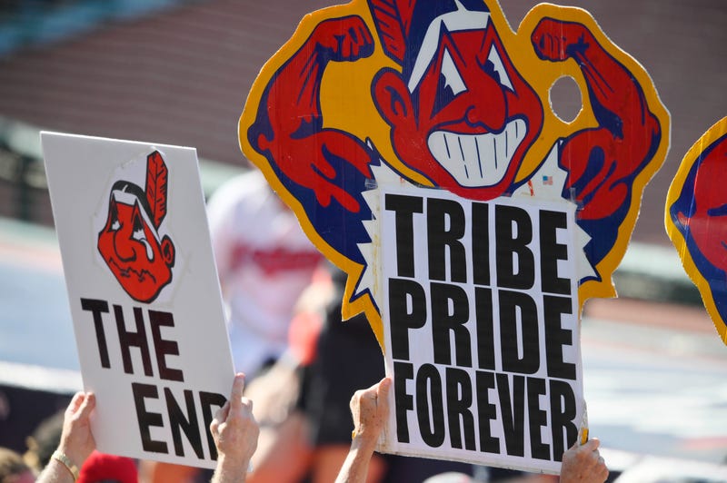 Sep 27, 2021; Cleveland, Ohio, USA; Fans hold signs featuring Cleveland Indians mascot Chief Wahoo during a game between the Cleveland Indians and the Kansas City Royals at Progressive Field.