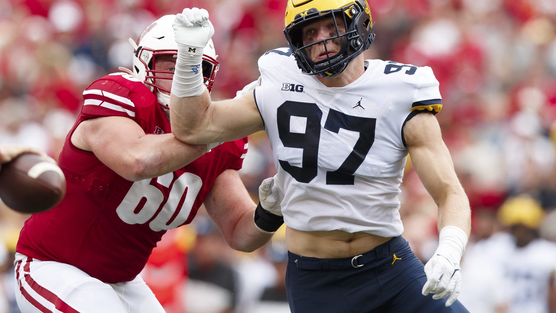 Harbaugh says 'freaky athletic' Hutchinson should go No. 1 in NFL Draft