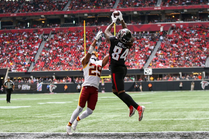 Atlanta Falcons running back Cordarrelle Patterson (84) catches a touchdown pass over Washington Football Team cornerback Kendall Fuller (29) in the second half at Mercedes-Benz Stadium.
