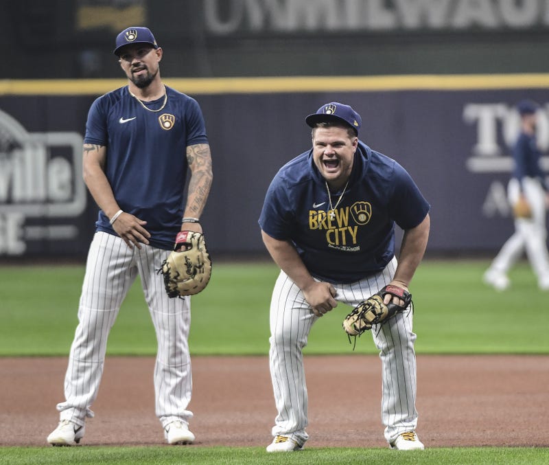 ; Milwaukee Brewers first baseman Daniel Vogelbach (right) laughs during NLDS workouts.