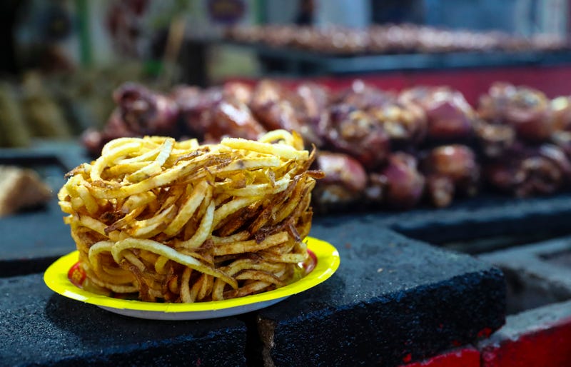 French fries and turkey legs at the State Fair of Texas before the game between the Oklahoma Sooners and Texas Longhorns at the Cotton Bowl in Dallas, Texas on Oct. 9, 2021.
