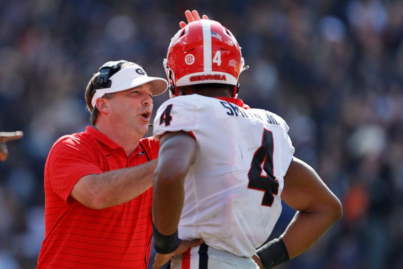 Oct 9, 2021; Auburn, Alabama, USA; Georgia Bulldogs head coach Kirby Smart talks to Georgia Bulldogs linebacker Nolan Smith (4) during the first quarter against the Auburn Tigers at Jordan-Hare Stadium.