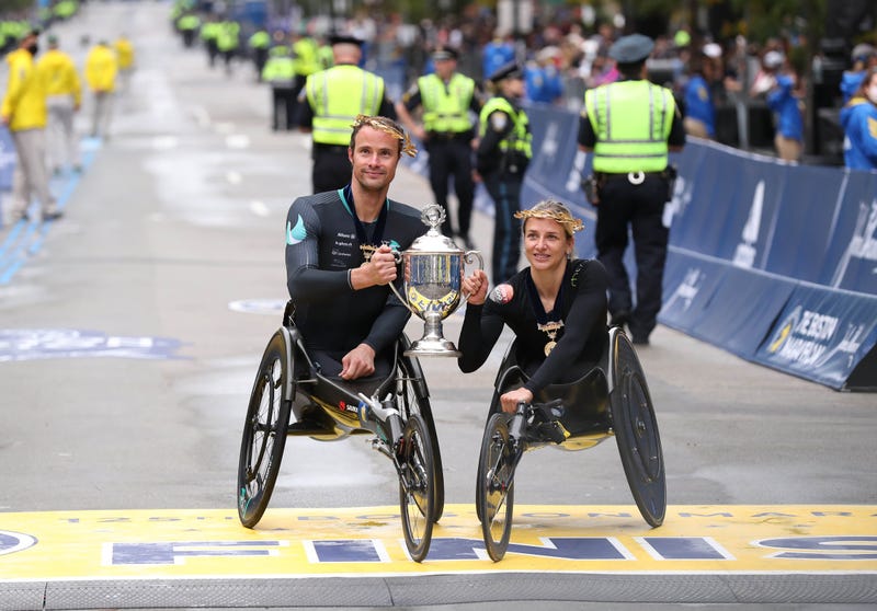 Marcel Hug and Manuela Schar celebrate their Boston Marathon wheelchair division wins