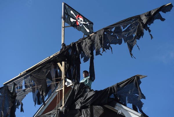 Flag flying over a pirate-themed house