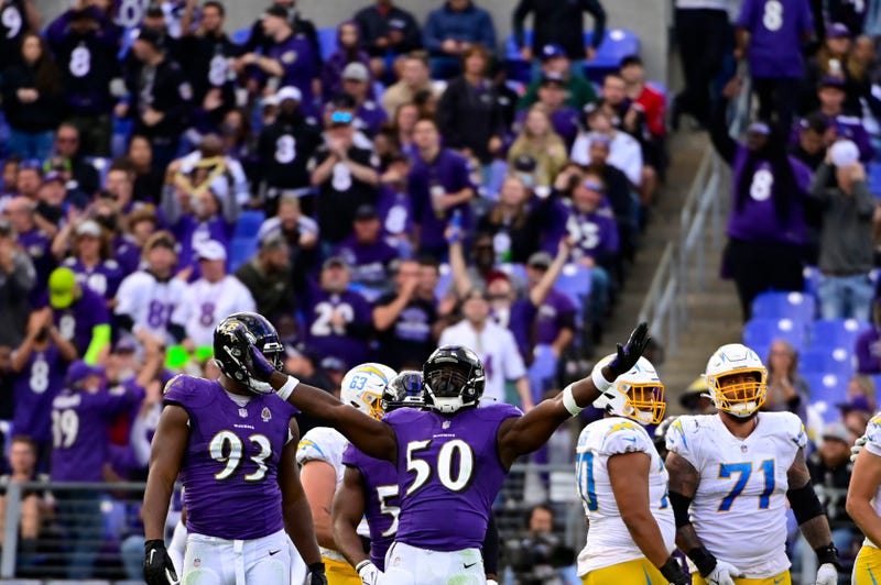 Ravens DE Justin Houston celebrates a sack