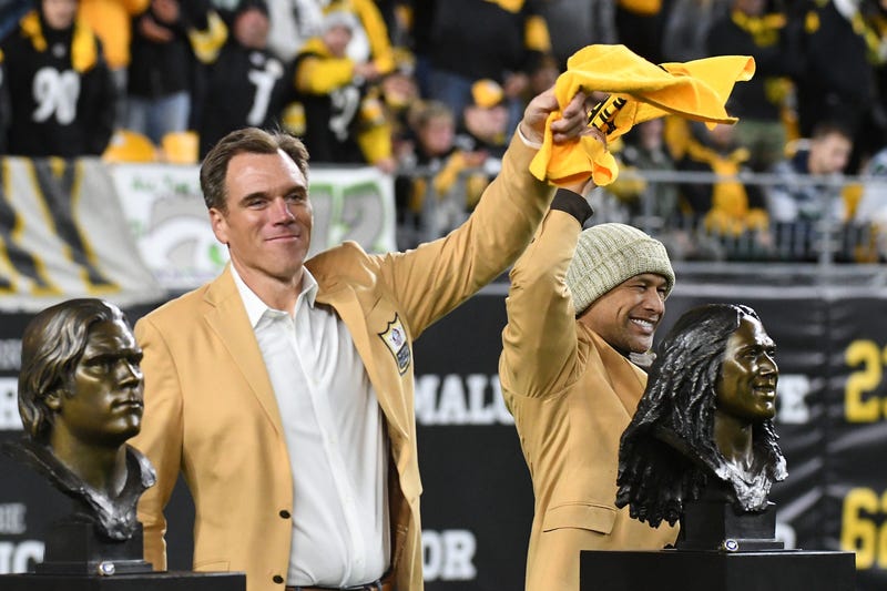Pittsburgh Steelers players Alan Faneca (left) and Troy Polamalu wave their Terrible Towels