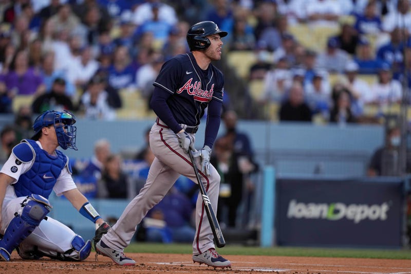 Atlanta Braves first baseman Freddie Freeman (5) hits a two run home run in the first inning against the Los Angeles Dodgers during game five of the 2021 NLCS at Dodger Stadium. 