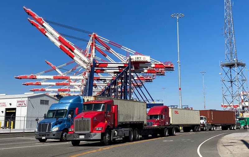 File photo of trucks lined up to enter one of the terminals at the Port of Long Beach. Supply chain issues have caused shortages of goods throughout the country with cargo ships waiting off shore in Southern California to off-load.