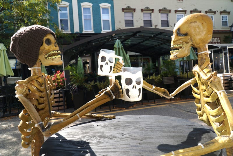  skeletons toast with mugs