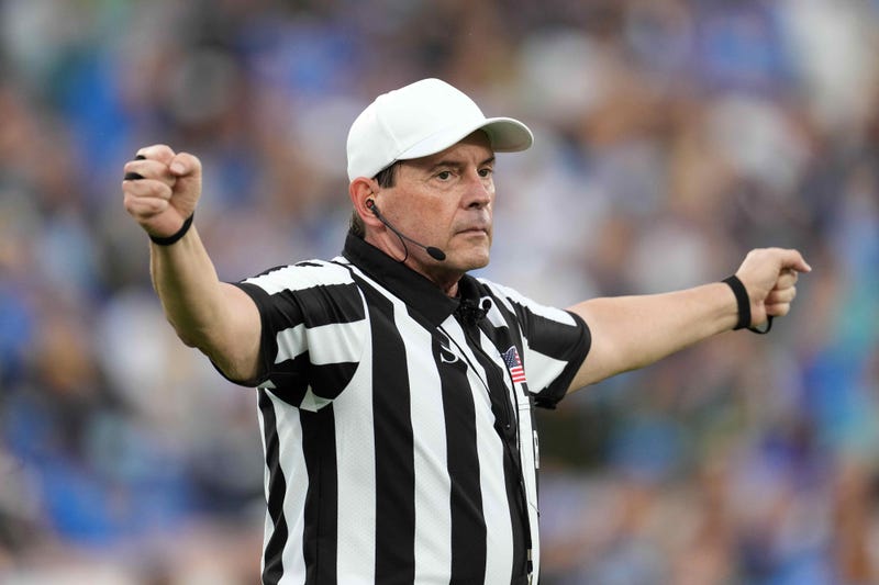 NCAA referee Mark Duddy gesturesin the second half of the game between the UCLA Bruins and the Oregon Ducks at Rose Bowl. Oregon defeated UCLA 34-31.
