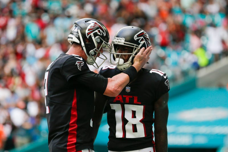 Atlanta Falcons wide receiver Calvin Ridley (18) gets a tap on the helmet from quarterback Matt Ryan (2) after scoring a touchdown 