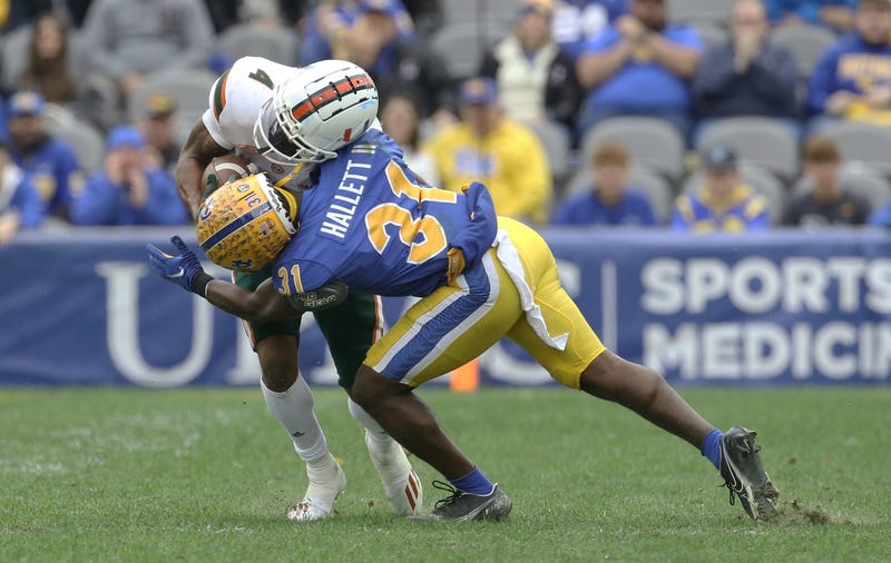 Erick Hallett making tackle against Miami