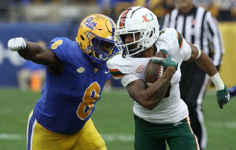 Calijah Kancey about to make a tackle against Miami